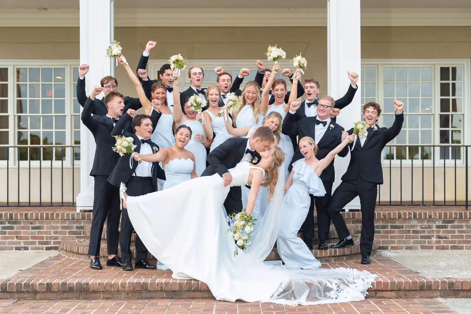Wedding party celebrating with the bride and groom at Pawleys Plantation.