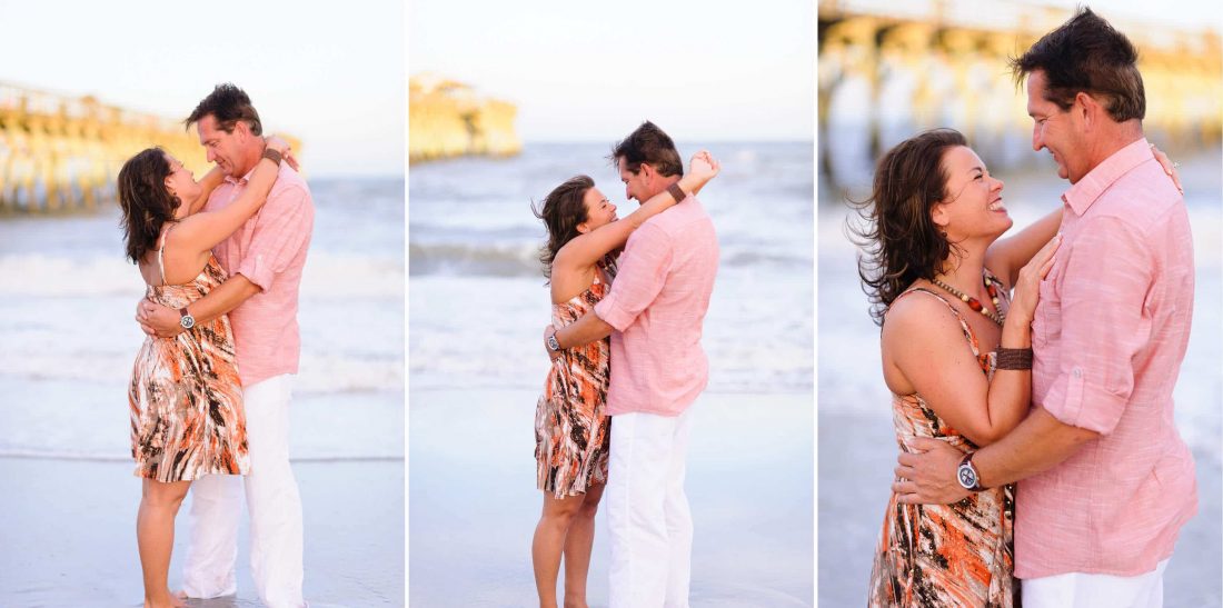 Couple smiling at each other in front of the pier