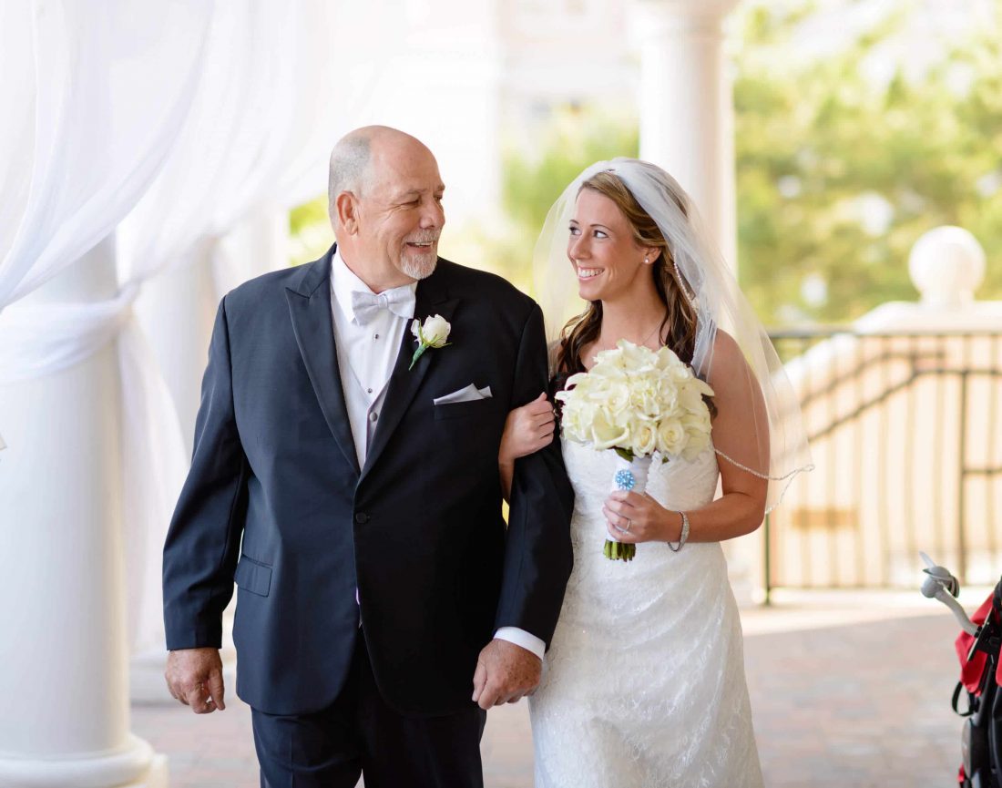 Bride and father walking towards ceremony on the Ocean Club terrace