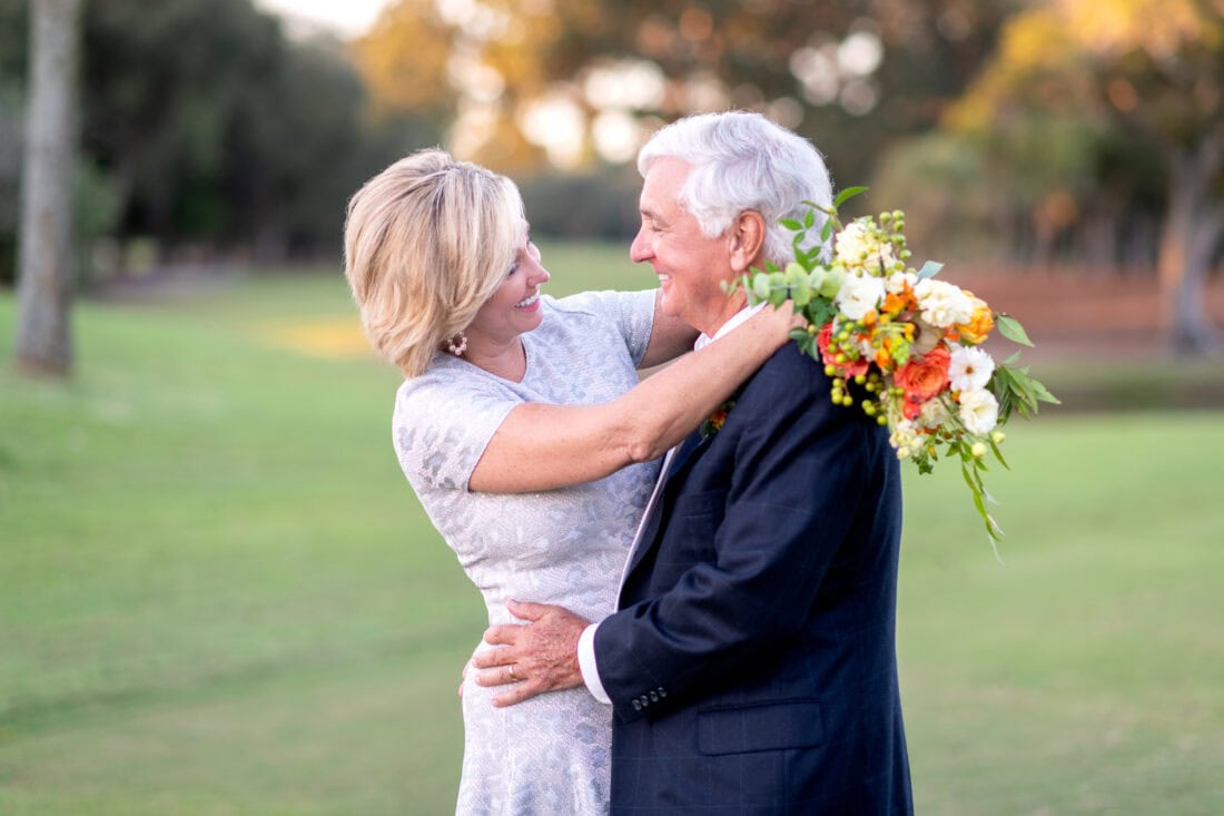 Happy couple smiling at each other on the golf course - Dunes Golf and Beach Club - Myrtle Beach