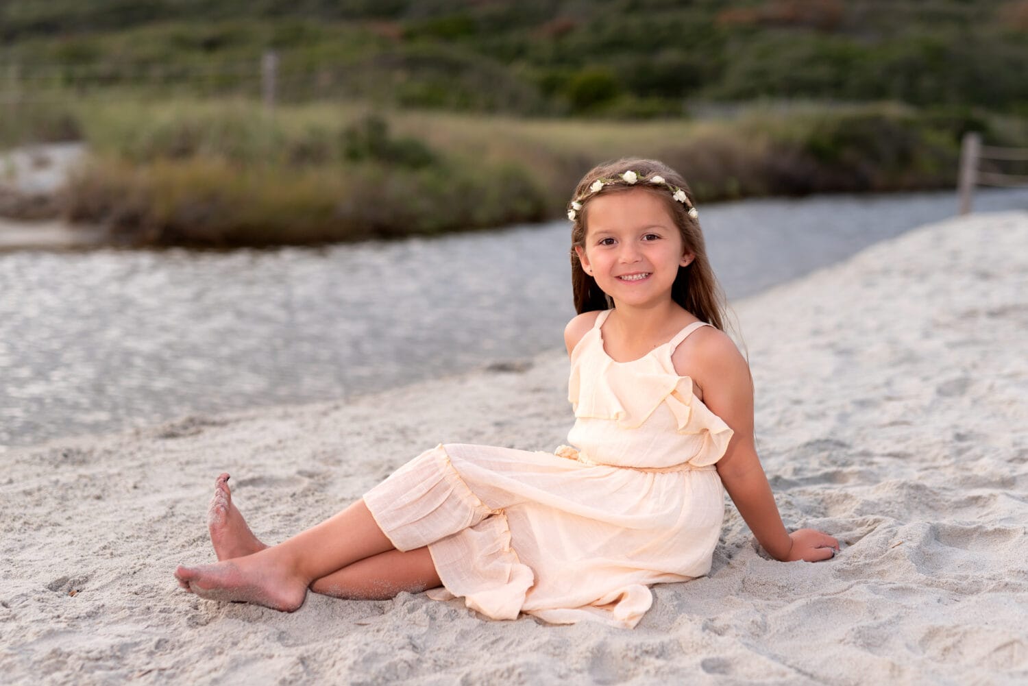Little girl sitting in the sand - Myrtle Beach State Park