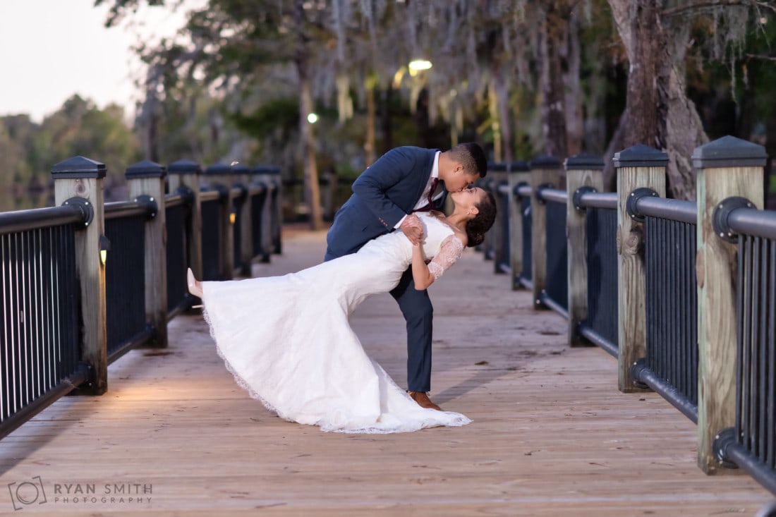 Dip back for a kiss with streetlights in the background and lit by my studio lights - Conway Riverwalk