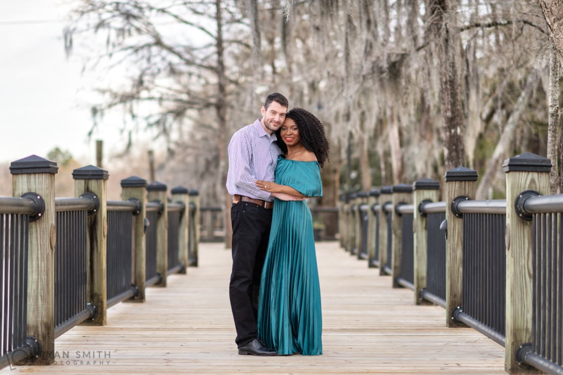 Embracing under the moss on the boardwalk - Conway Riverwalk