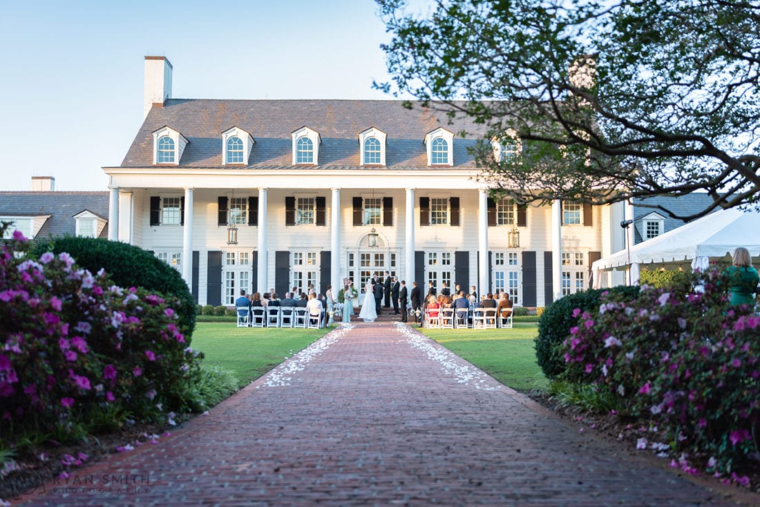 Sunset ceremony on the lawn facing the clubhouse - Pine Lakes Country Club