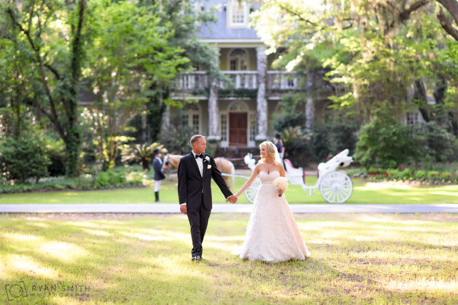 Bride and groom on the oak alley - Wachesaw Plantation