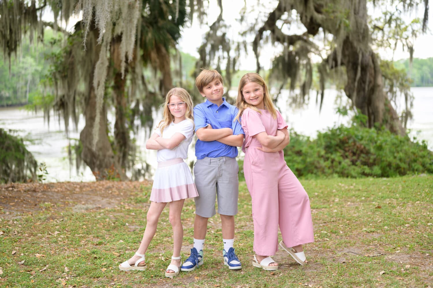 Brother giving a silly pose with his sister and cousin - Wachesaw Plantation