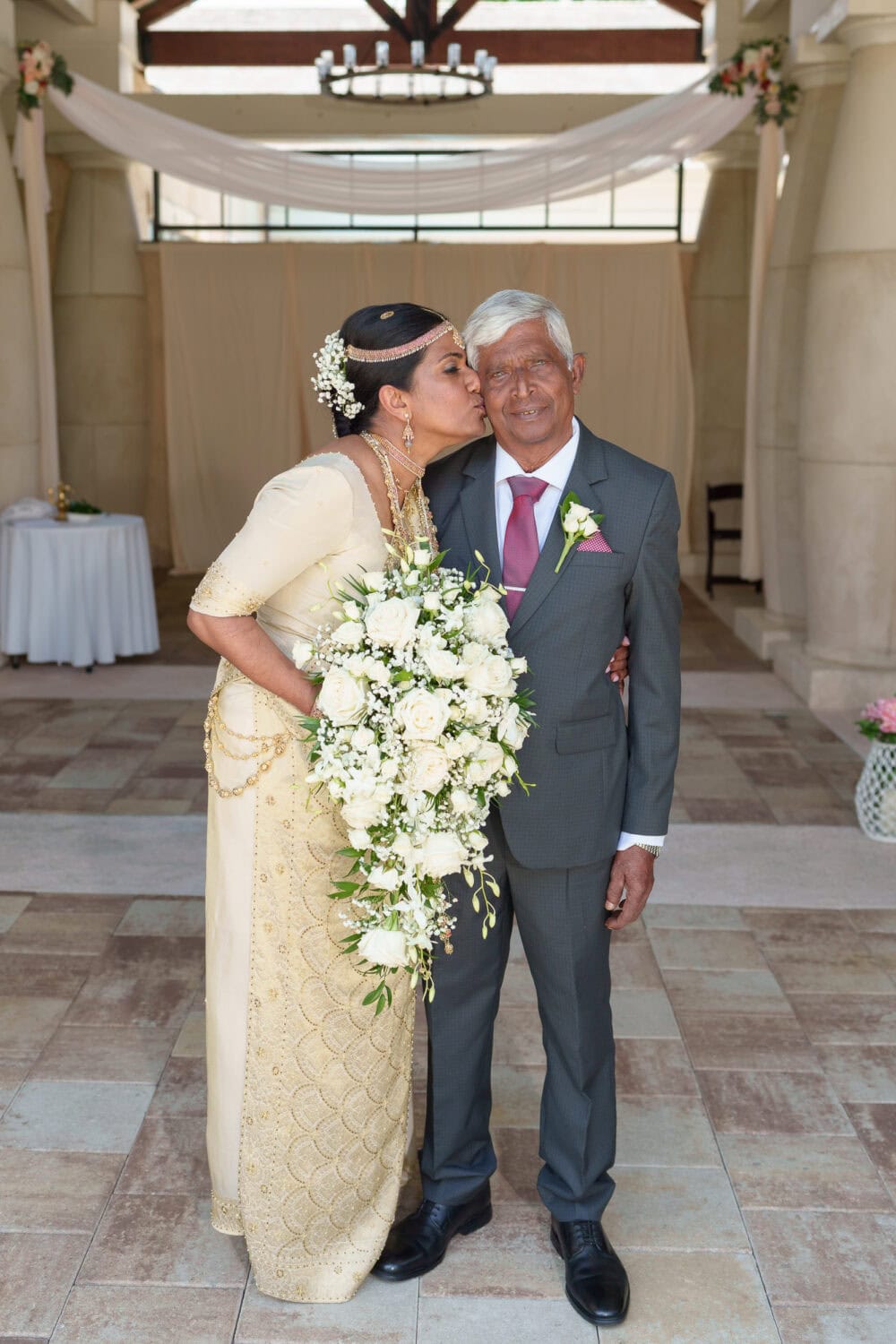 Bride giving father kiss on the cheeks - 21 Main Events