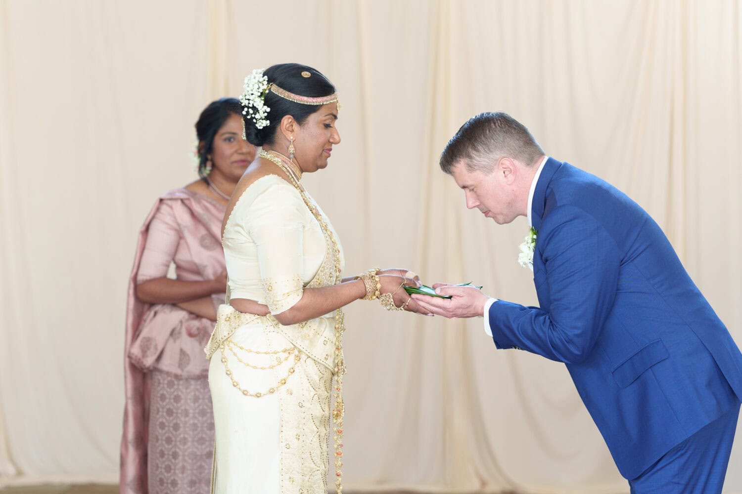 Groom giving betel leaves to the bride part of Sri Lankan ceremony - 21 Main Events