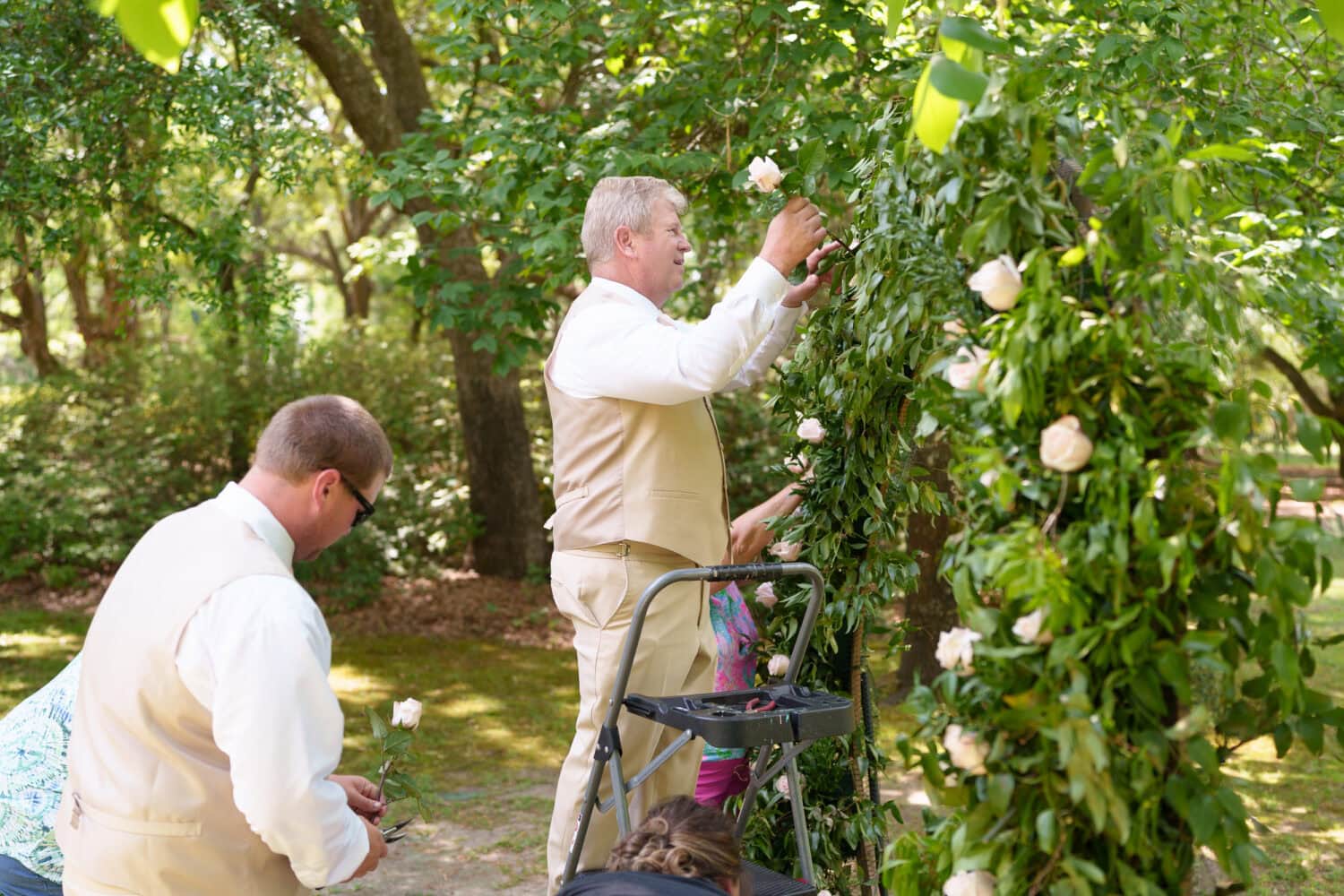 Groomsmen working on the ceremony arch - Tanglewood Plantation