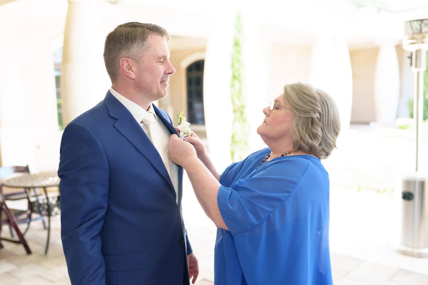 Mom helping groom with boutonniere - 21 Main Events