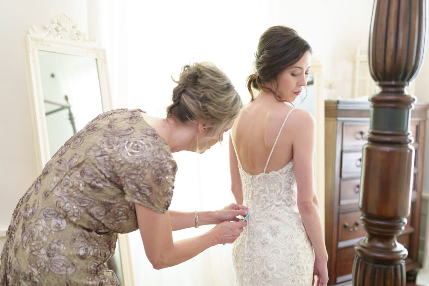 Mother helping bride with her dress - Tanglewood Plantation
