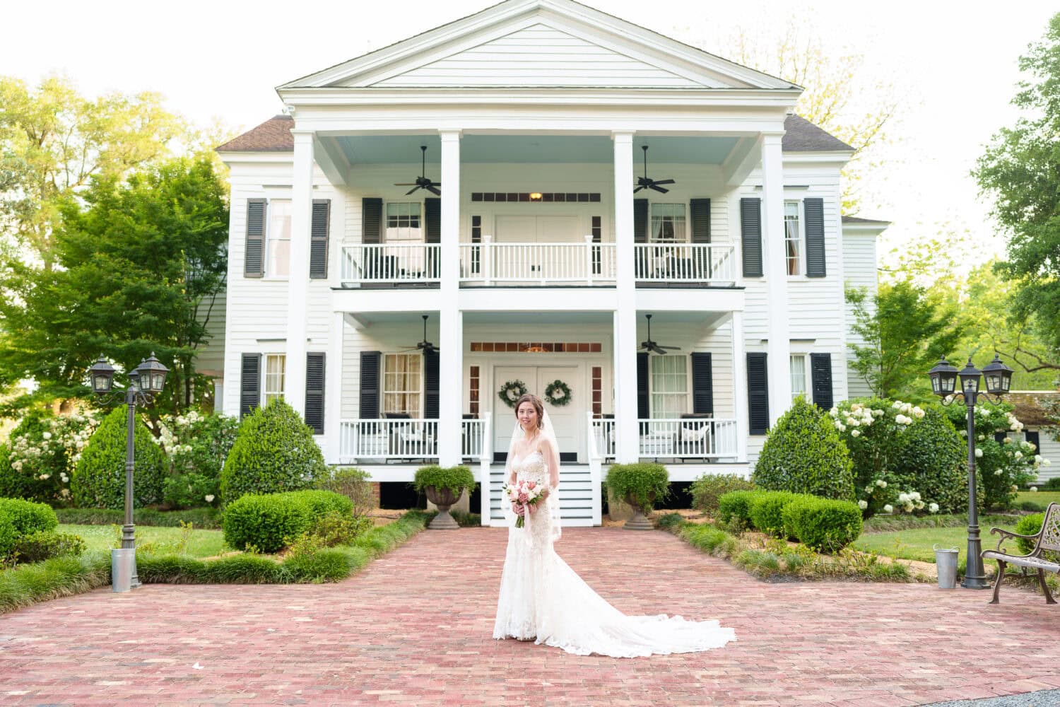 Portraits of bride and groom in front of the plantation house - Tanglewood Plantation