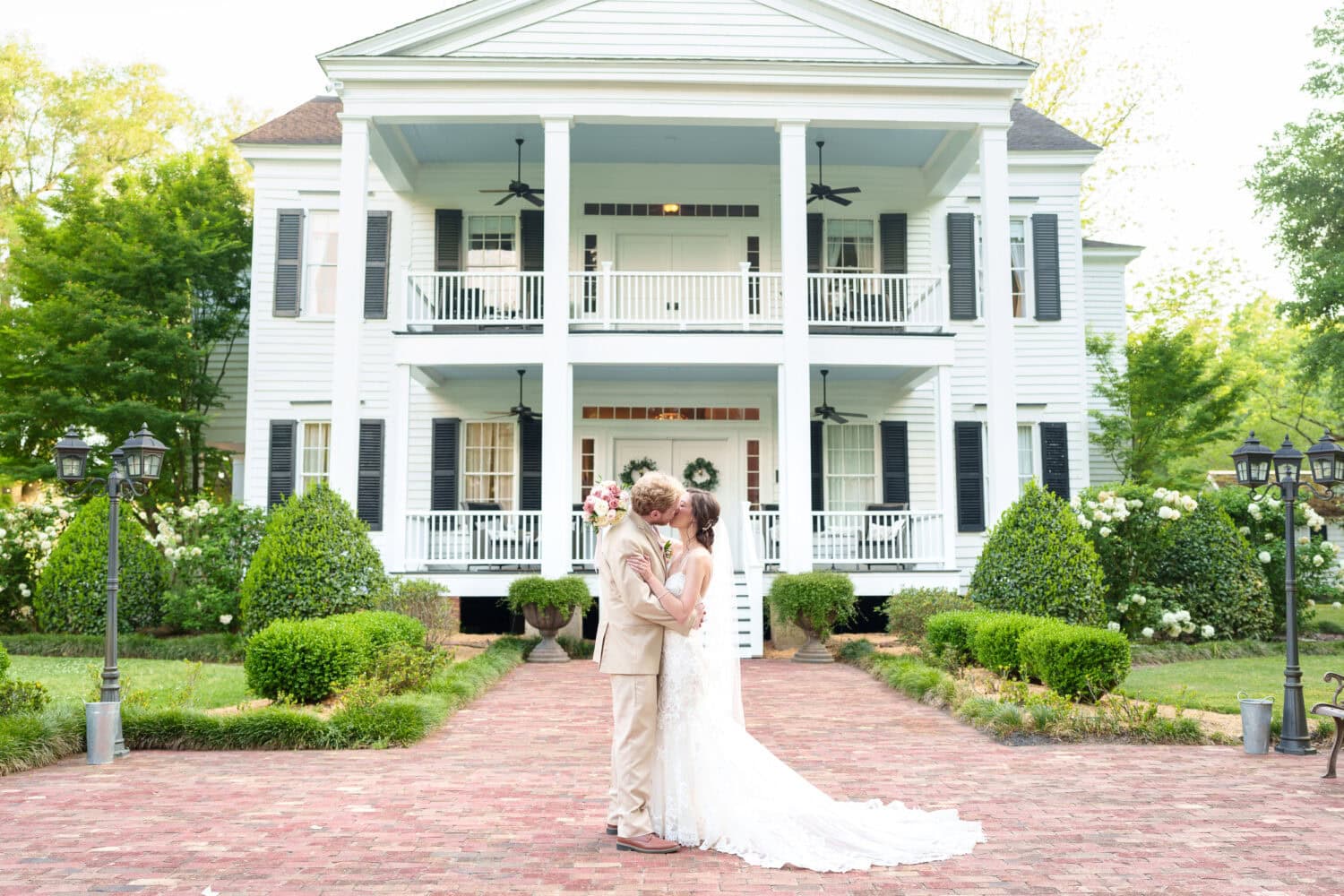 Portraits of bride and groom in front of the plantation house - Tanglewood Plantation