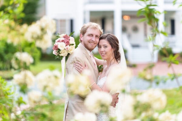 Portraits of the bride and groom surrounded by the flowers - Tanglewood Plantation