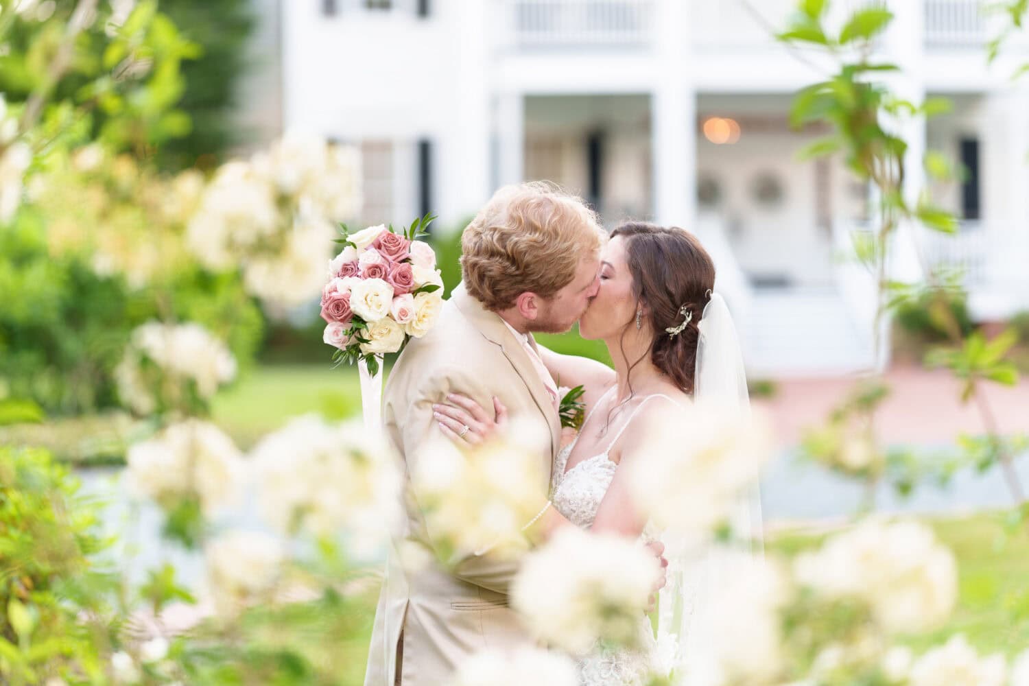 Portraits of the bride and groom surrounded by the flowers - Tanglewood Plantation