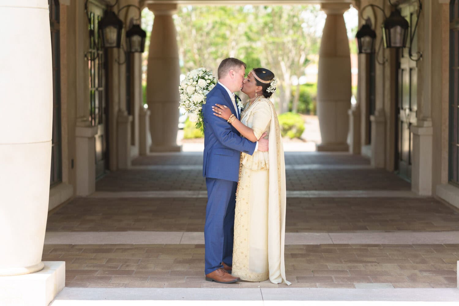 Portraits of the bride and groom under the columns in the courtyard - 21 Main Events