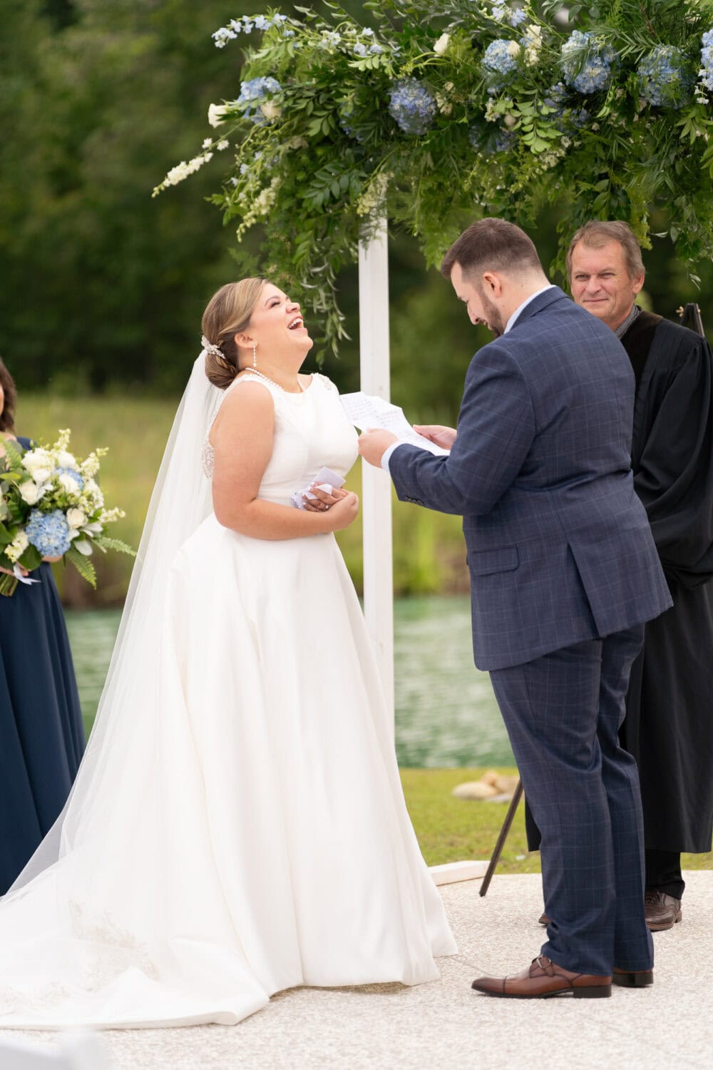 Bride and groom during the ceremony - White Oaks Farm