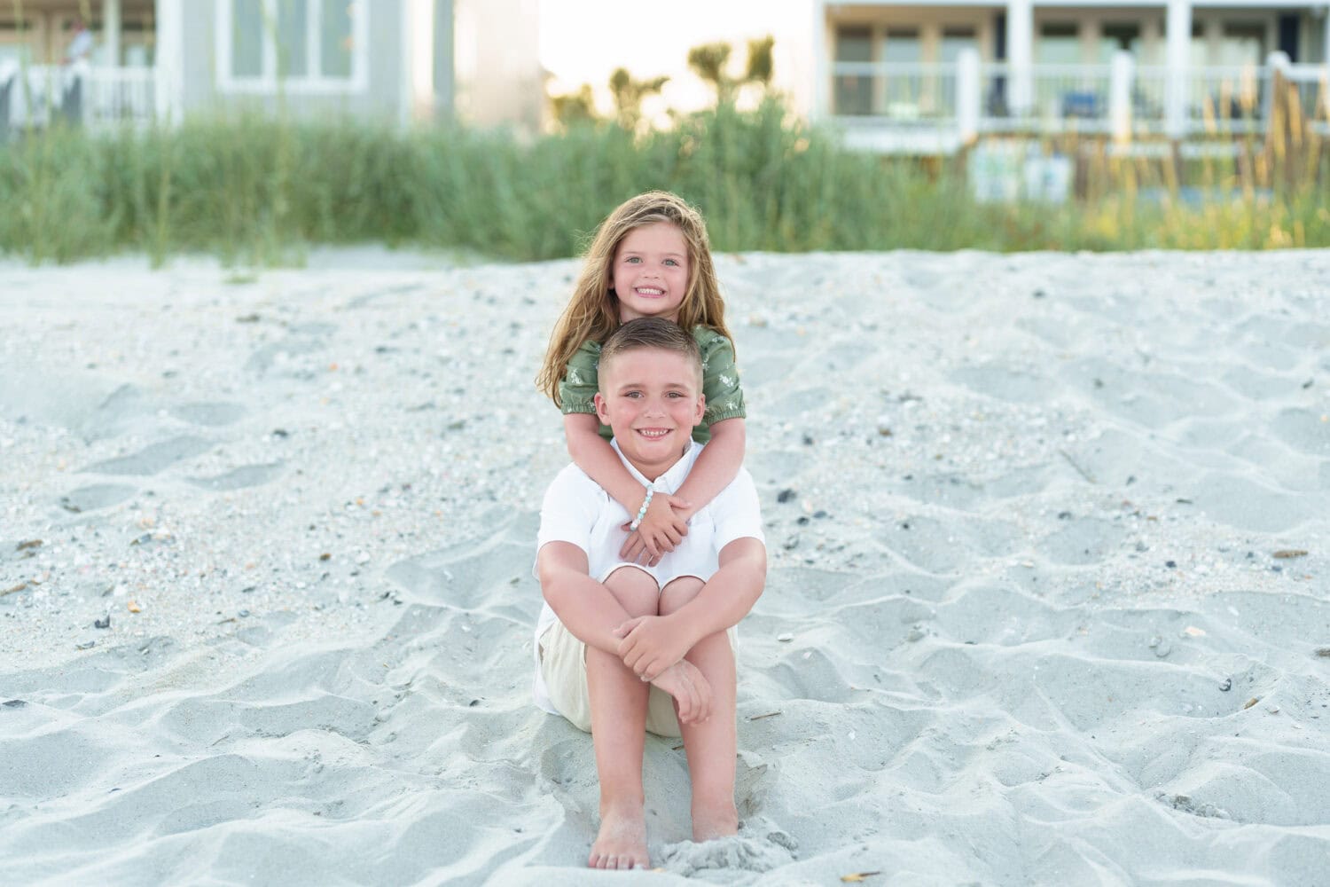 Brother with little sister by the dunes - Myrtle Beach