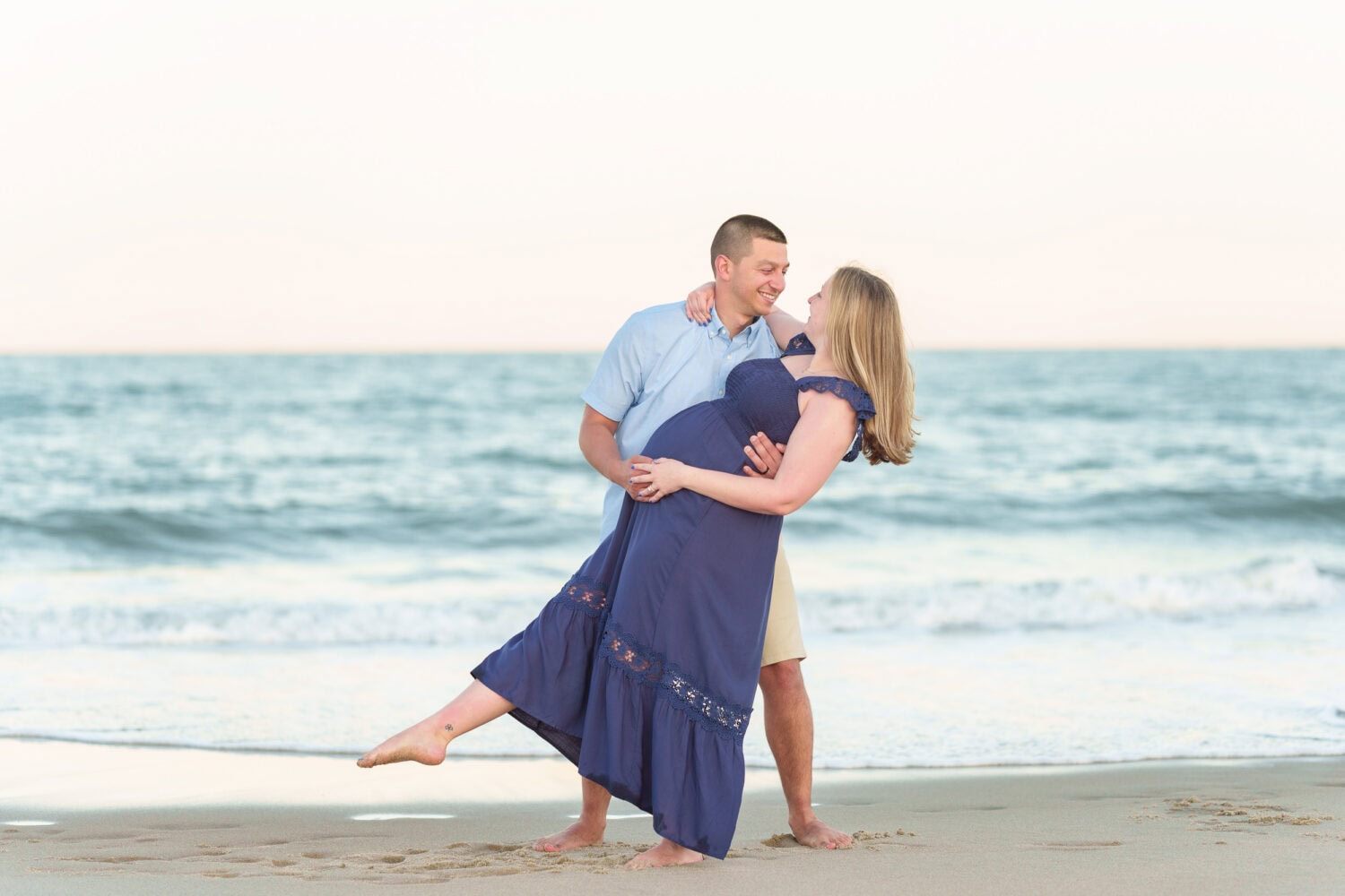 Dip back by husband maternity portrait in front of the ocean - Huntington Beach State Park