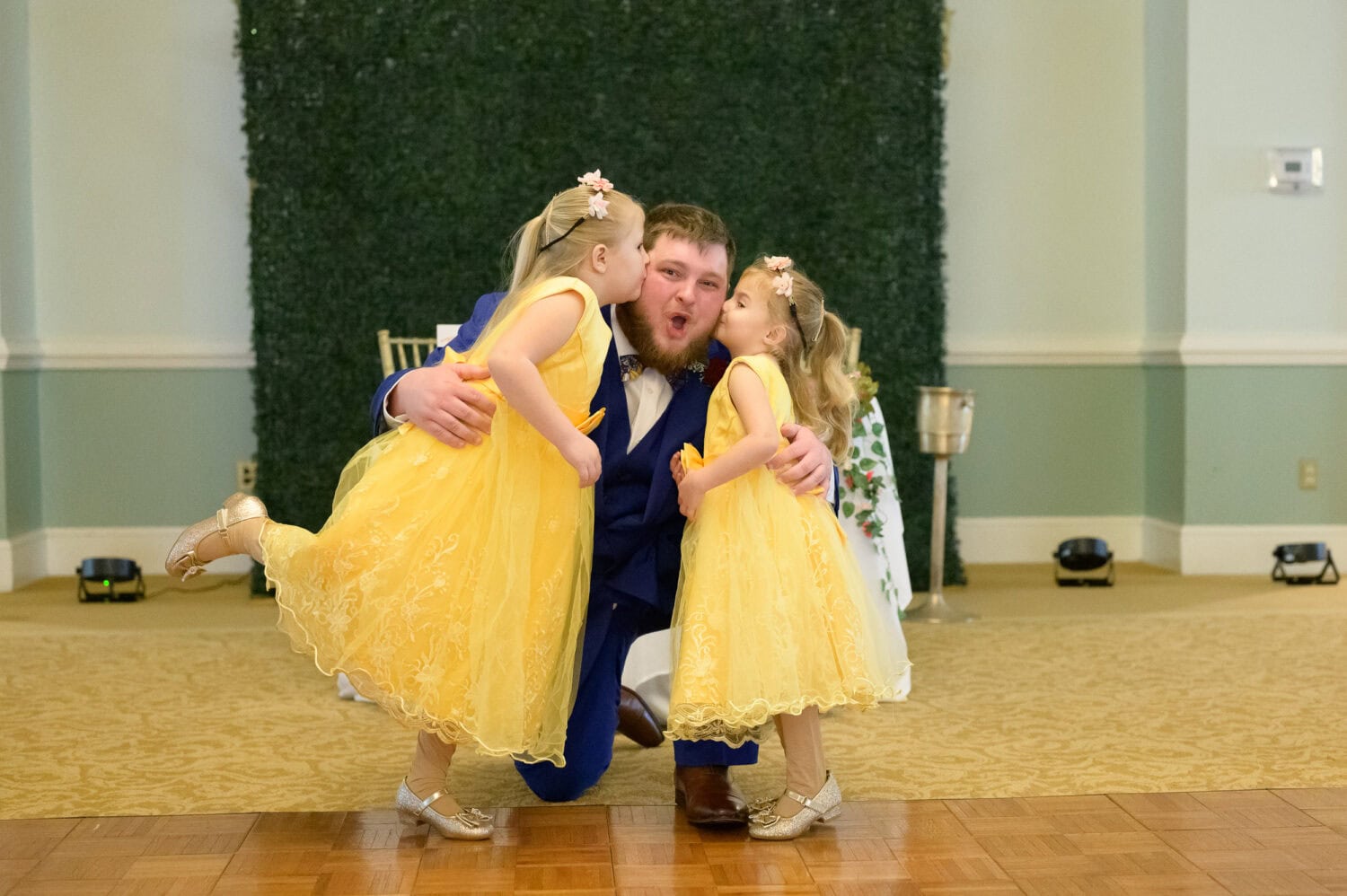 Groom getting a kiss from the flower girls - Pawleys Plantation