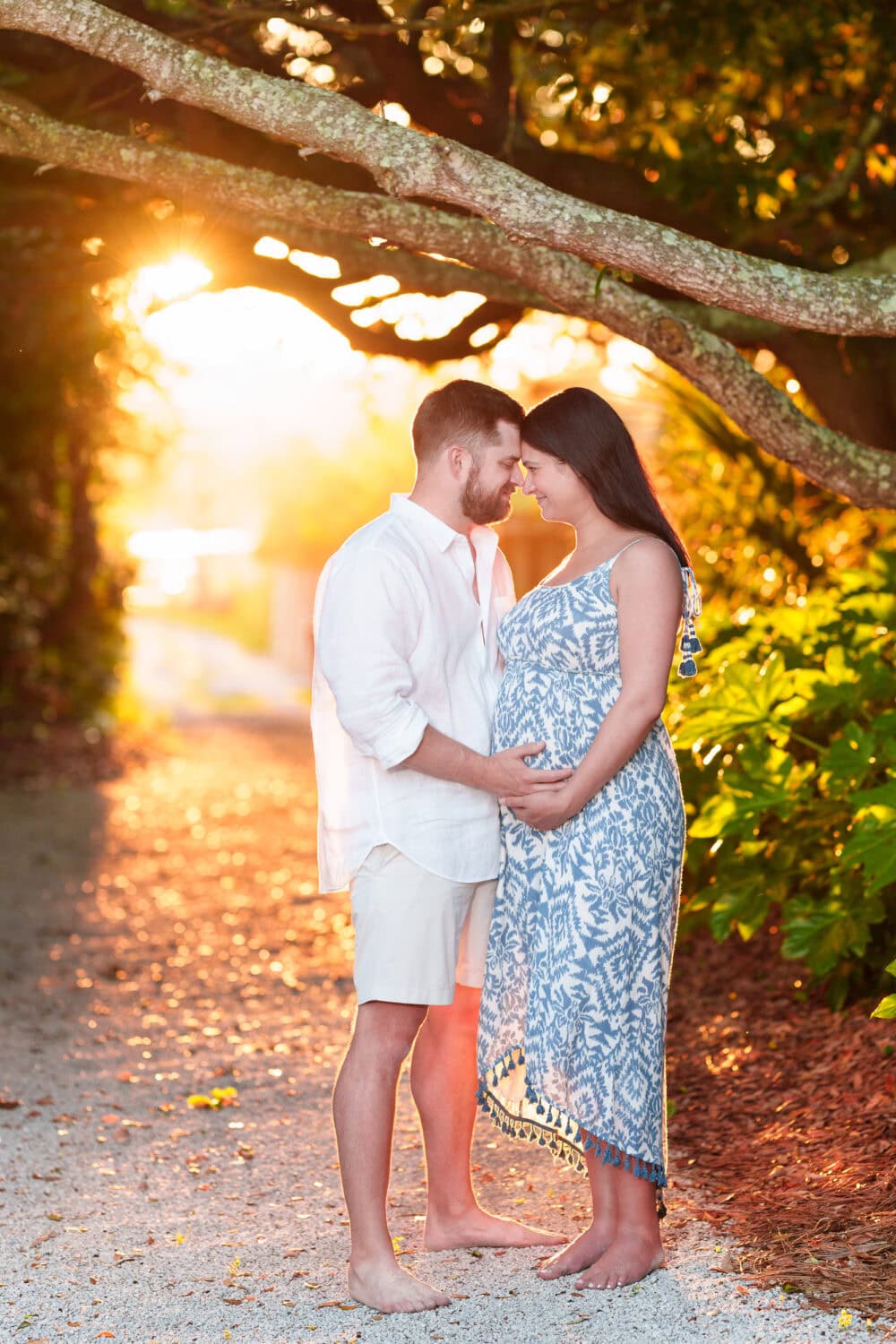 Maternity portrait with sunset peeking out from behind the trees - Pawleys Island