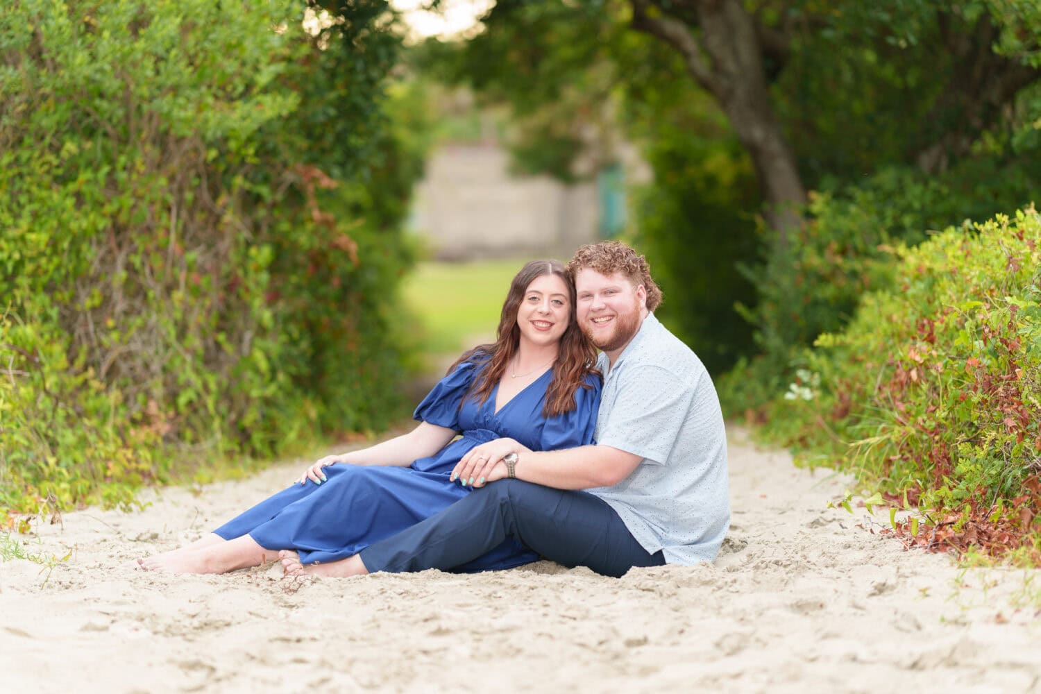Just engaged couple laying under the trees - Huntington Beach State Park