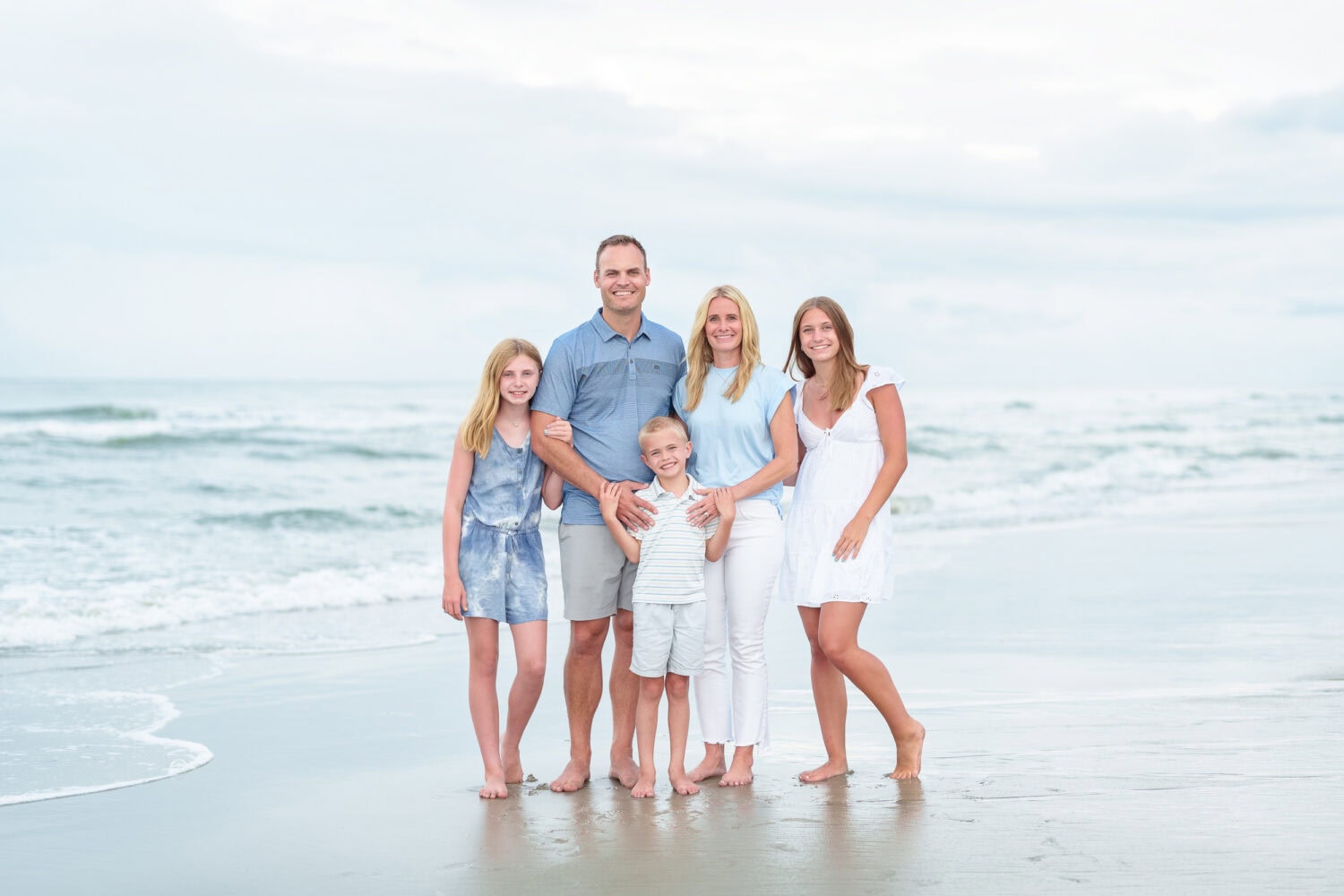 Family of 5 with a nice sky after a rainy day on the beach - Huntington Beach State Park