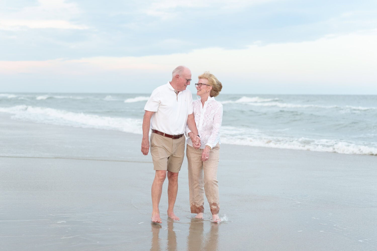 Grandparents walking together down the beach - Huntington Beach State Park