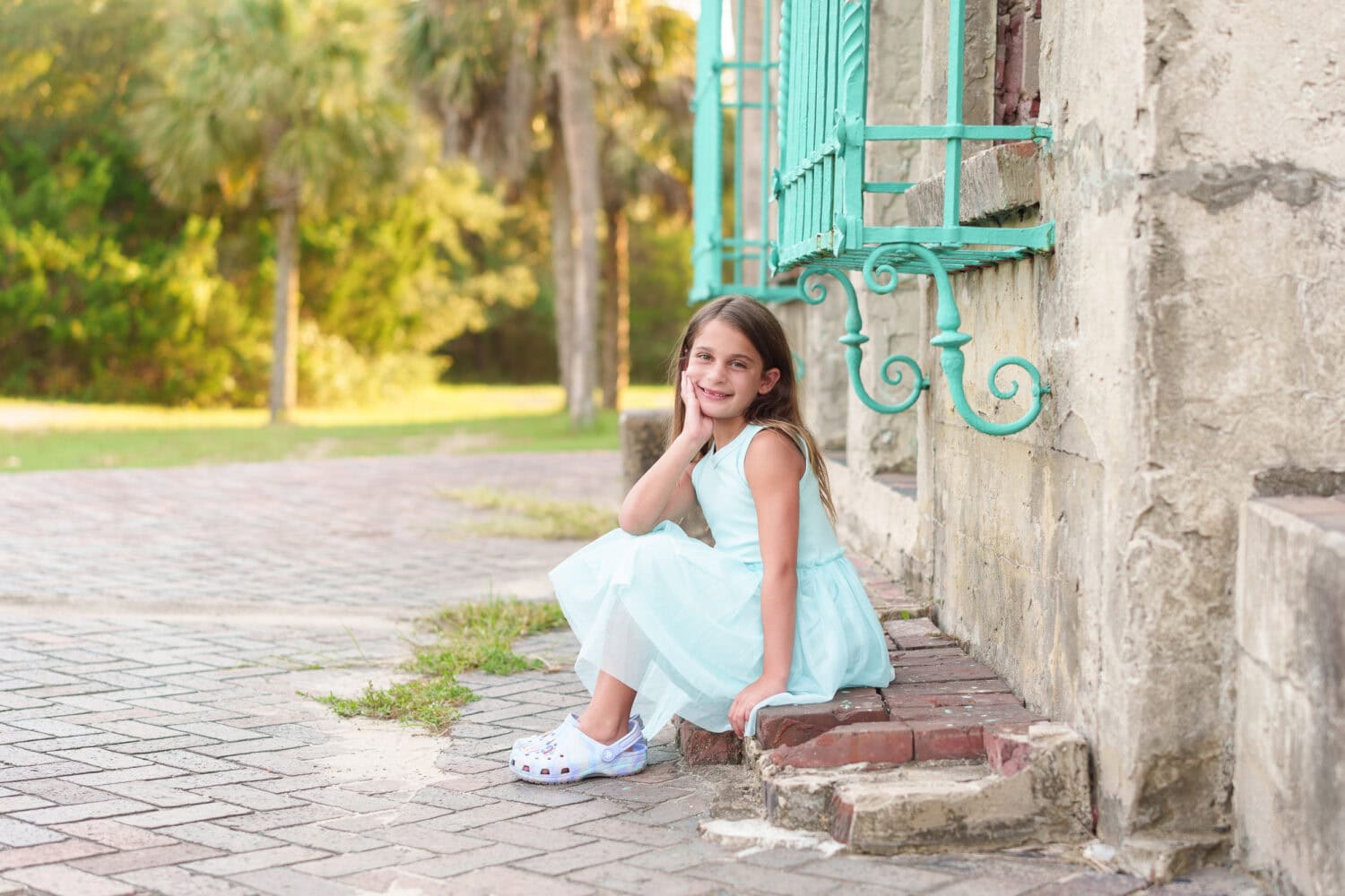 Little girl sitting by the castle - Huntington Beach State Park - Pawleys Island