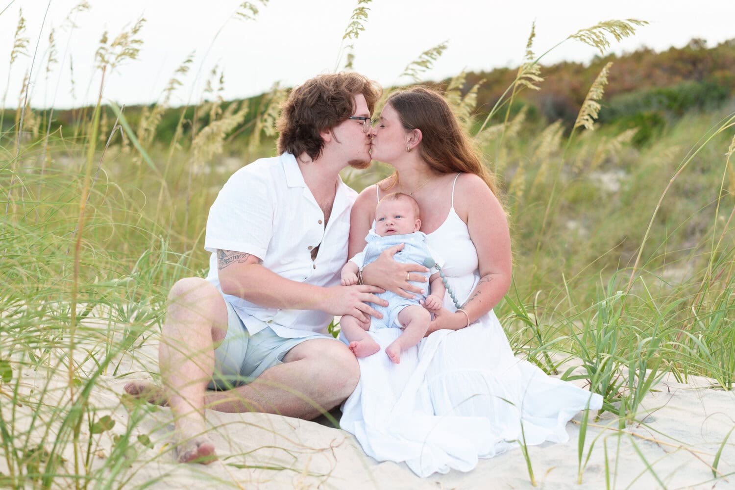 Mom and dad with baby by the sea oats - Huntington Beach State Park