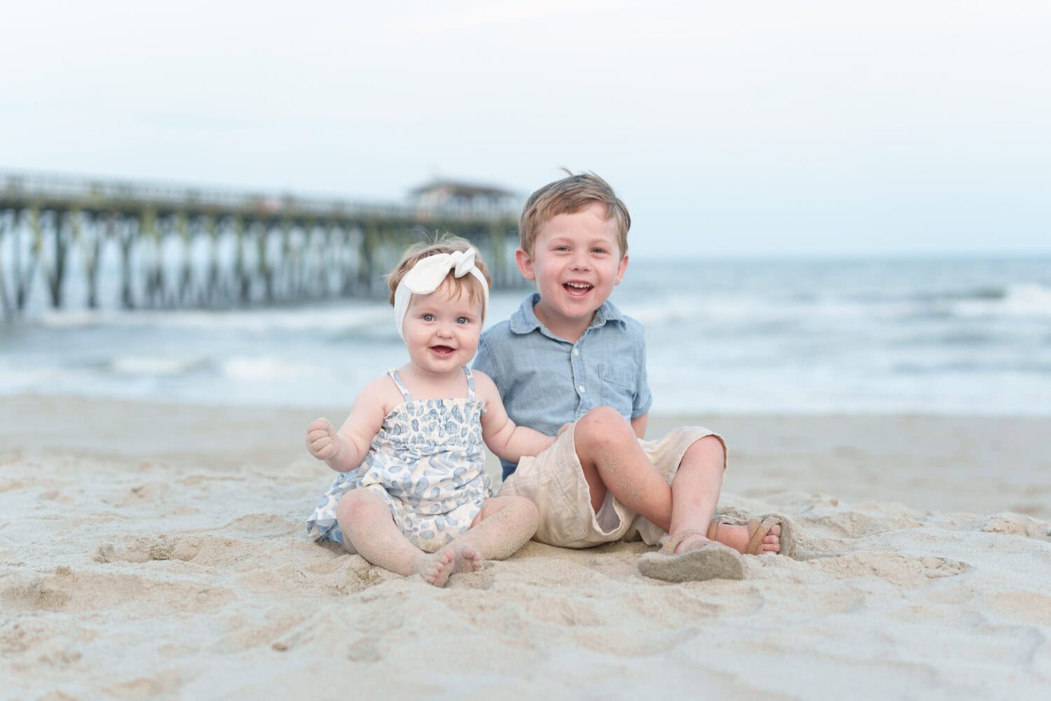 Toddler brother and sister in front of the ocean - Myrtle Beach State Park