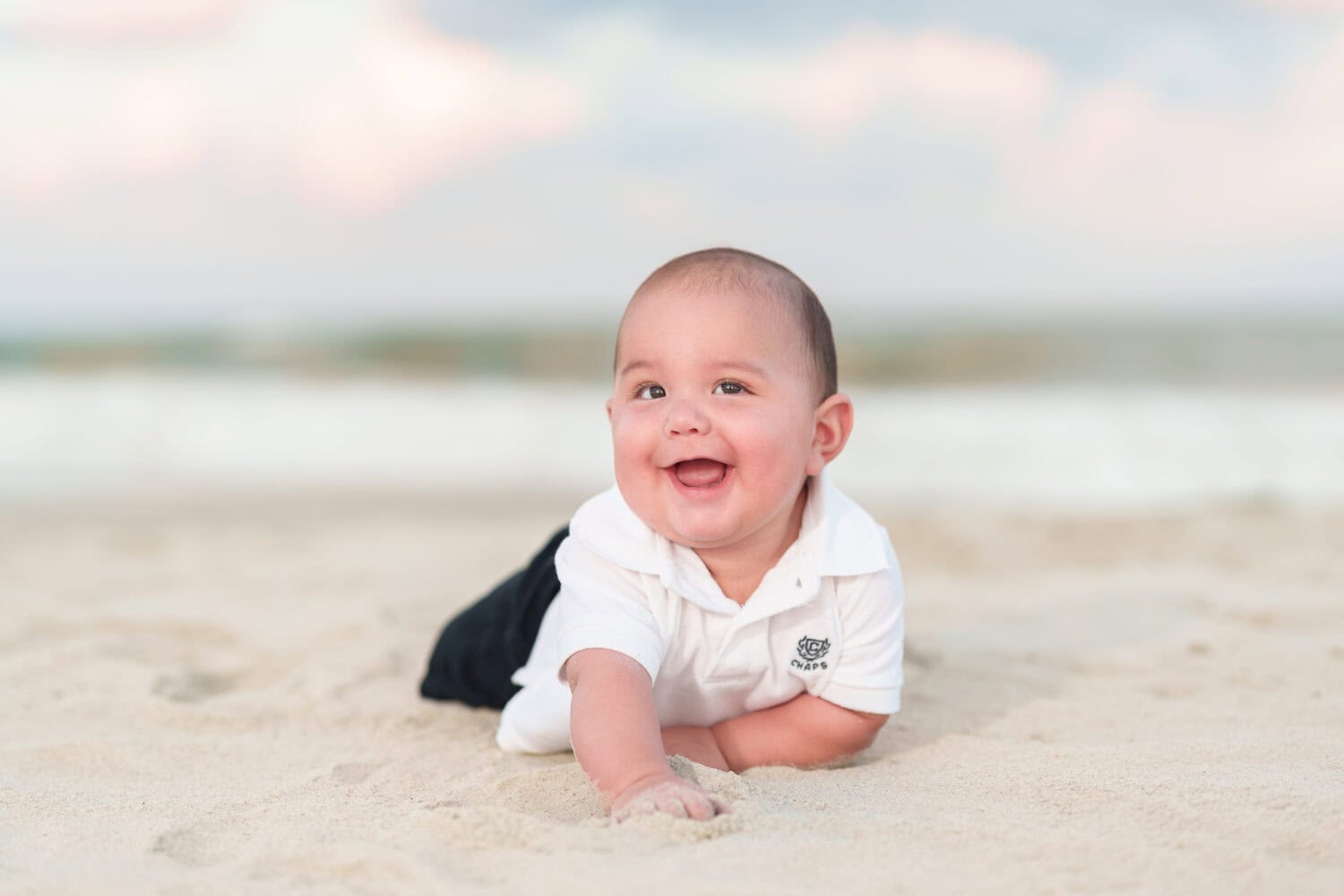 Newly adopted baby boy giving a cute expression by the ocean - Huntington Beach State Park - Pawleys Island