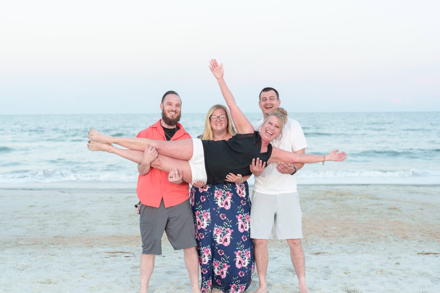 Adult kids lifting mom up in the air - Huntington Beach State Park - Pawleys Island