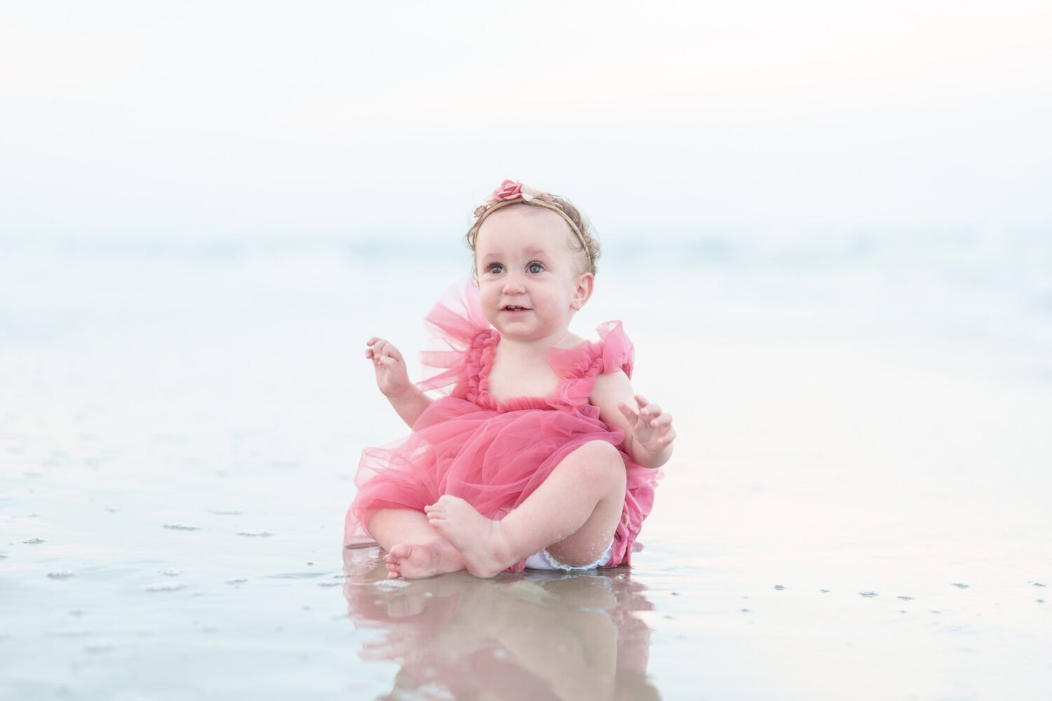 Baby girl sitting in water - Huntington Beach State Park - Pawleys Island