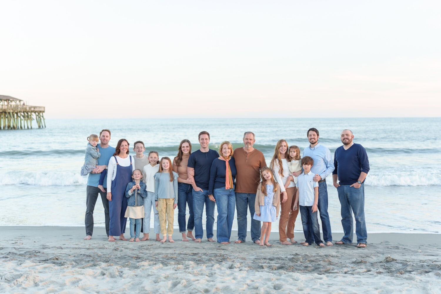 Big family group in front of the ocean and pier - Myrtle Beach State Park