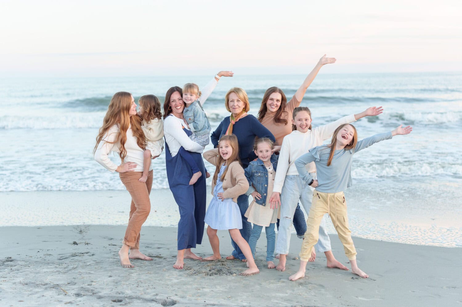 Big family group in front of the ocean and pier - Myrtle Beach State Park