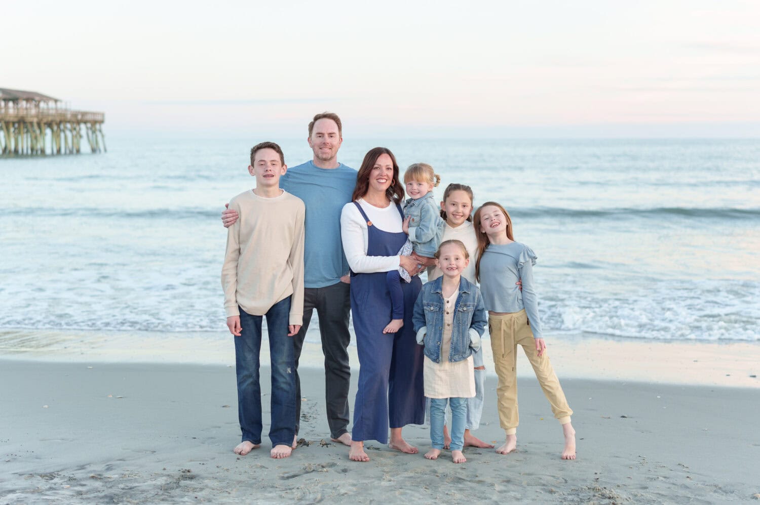 Big family group in front of the ocean and pier - Myrtle Beach State Park