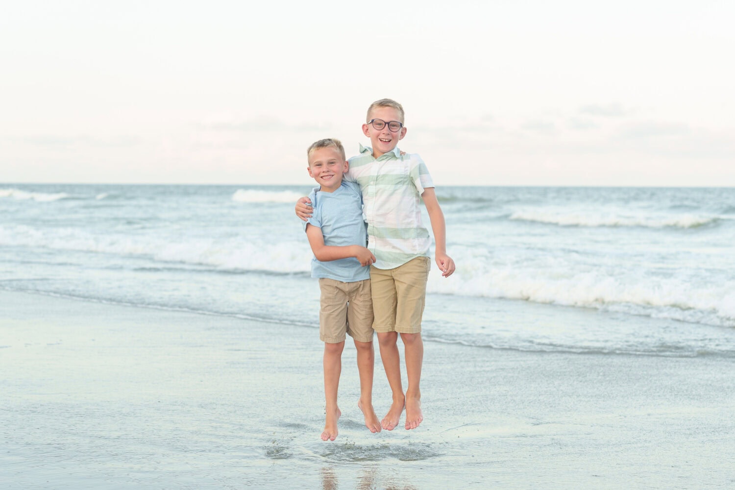 Brothers jumping by the water - Huntington Beach State Park - Pawleys Island