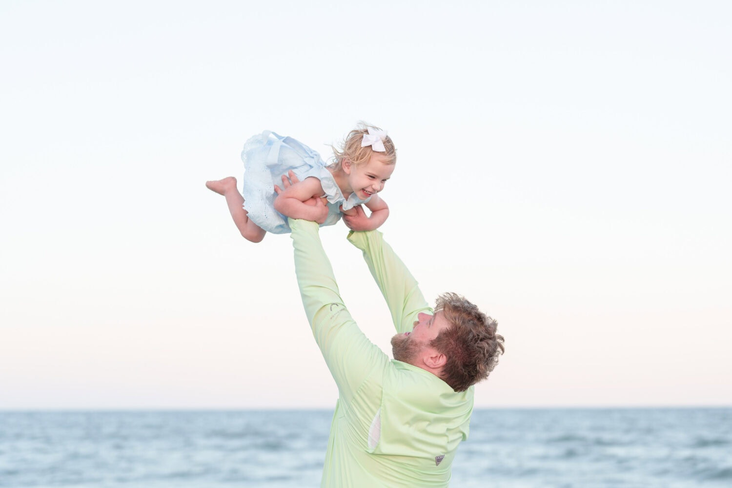 Dad holding baby girl in the air - Huntington Beach State Park - Pawleys Island