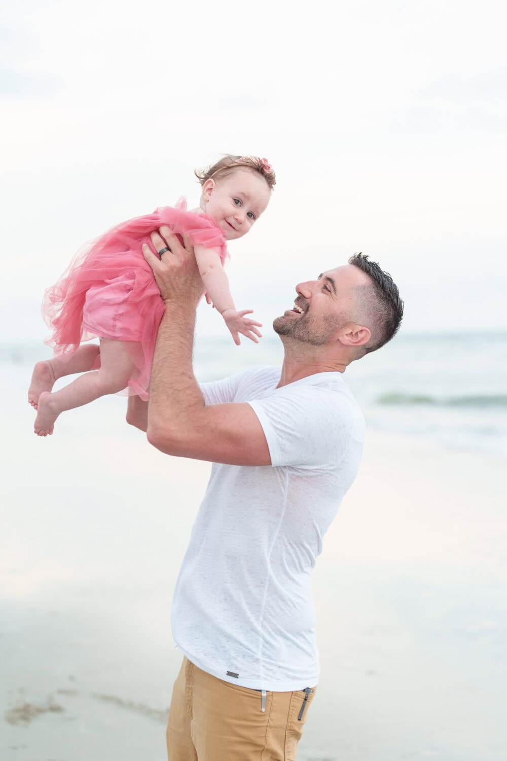 Dad little baby daughter in the air - Huntington Beach State Park - Pawleys Island