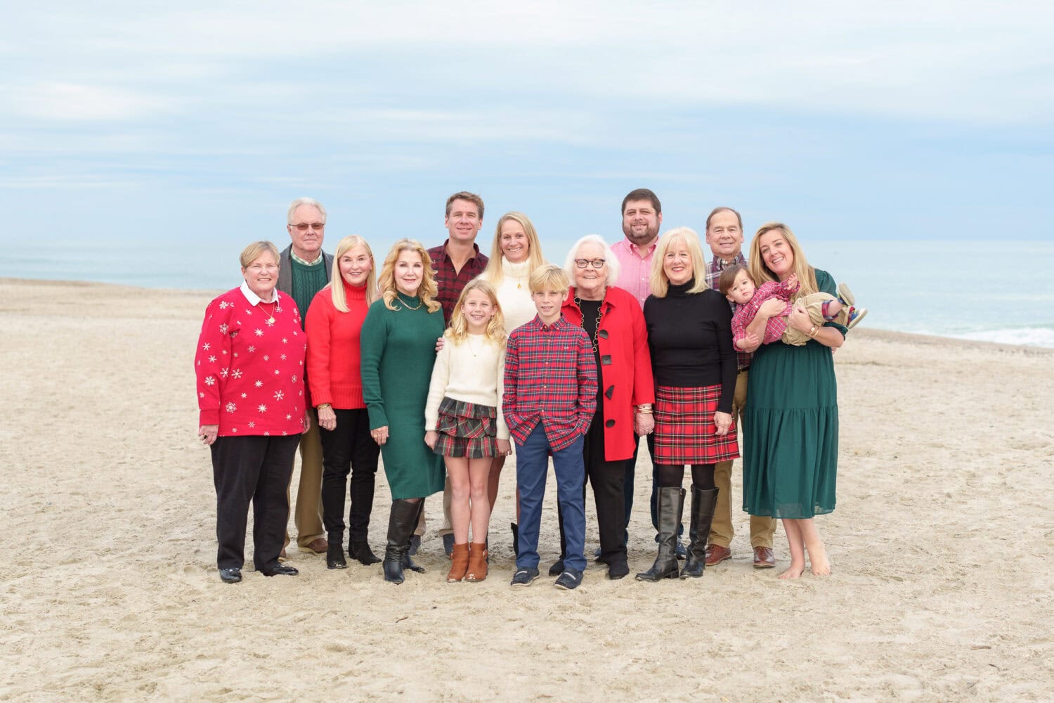 Family group in thier winter outfits on the beach - Debordieu