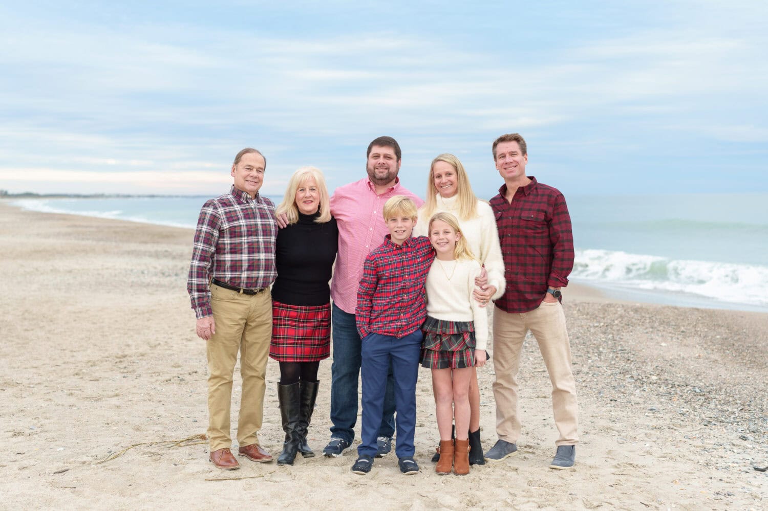 Family group in thier winter outfits on the beach - Debordieu