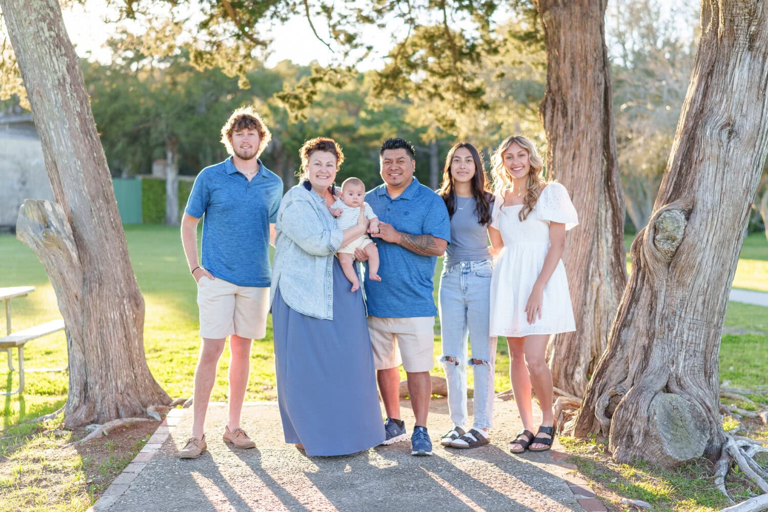 Family with older children and a new baby boy - Huntington Beach State Park