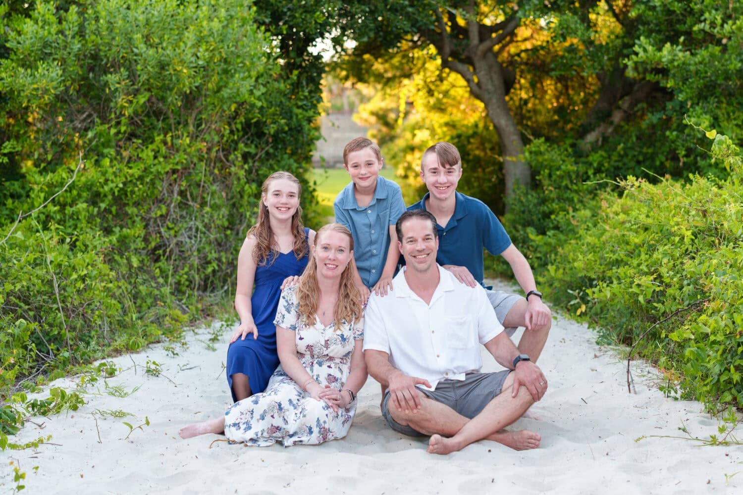 Happy family of 5 on the path to the beach - Huntington Beach State Park