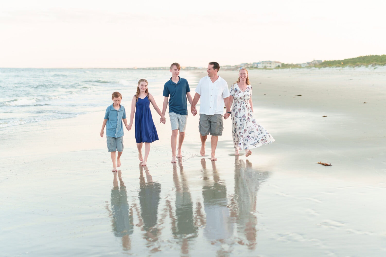 Happy family of 5 walking down the beach - Huntington Beach State Park - Pawleys Island