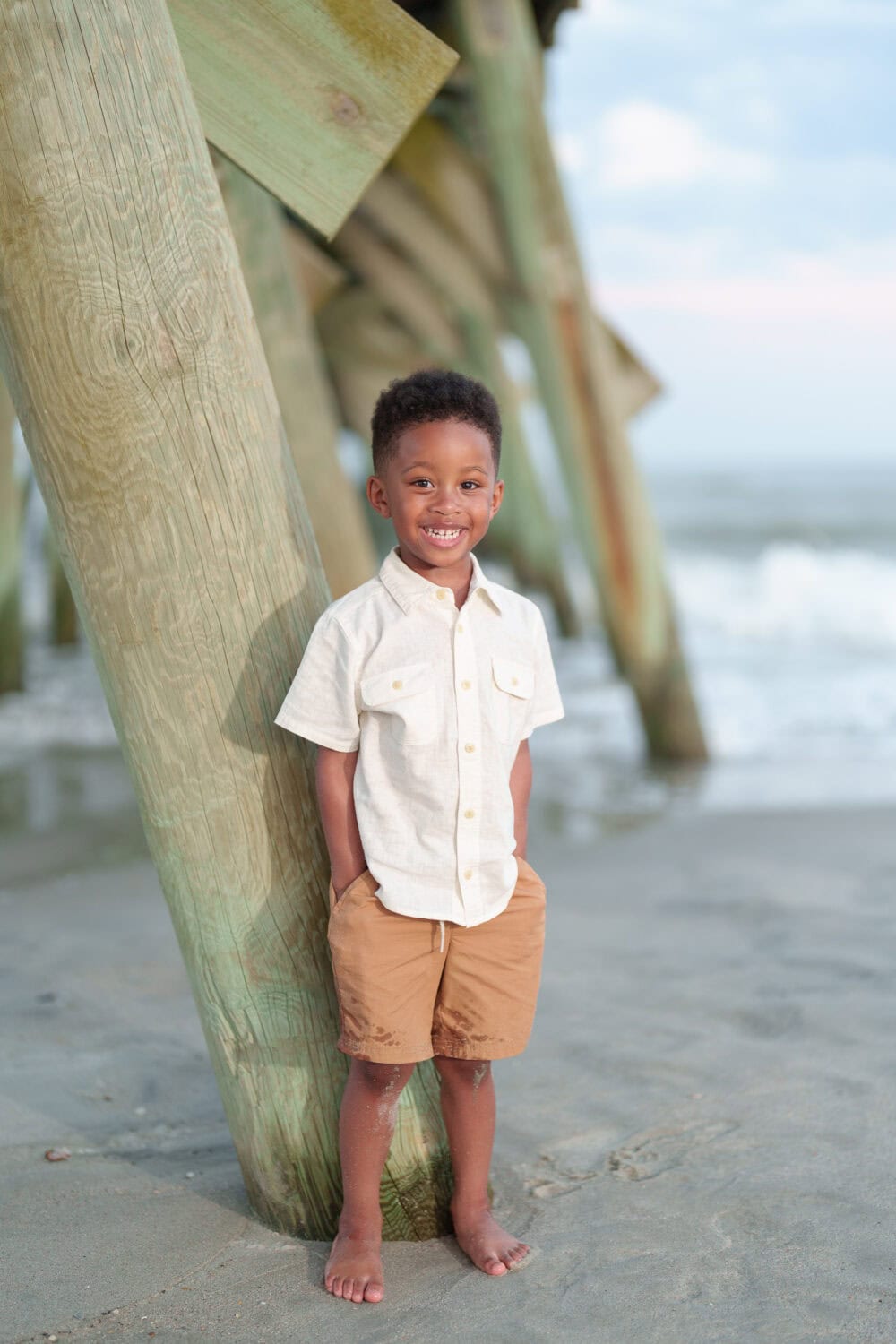 Little boy leaning against the pier - Myrtle Beach State Park