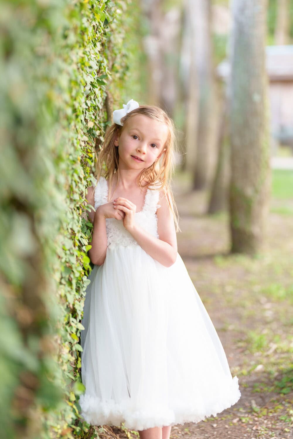 Little girl leaning against the ivy wall - Huntington Beach State Park - Pawleys Island