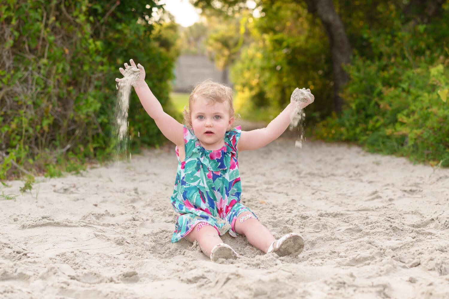 Little girl throwing sand in the air - Huntington Beach State Park - Pawleys Island