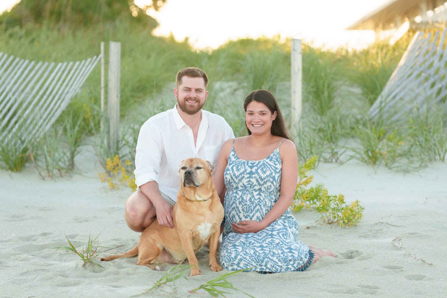 Maternity photos with their dog on the beach - Pawleys Island Beach House