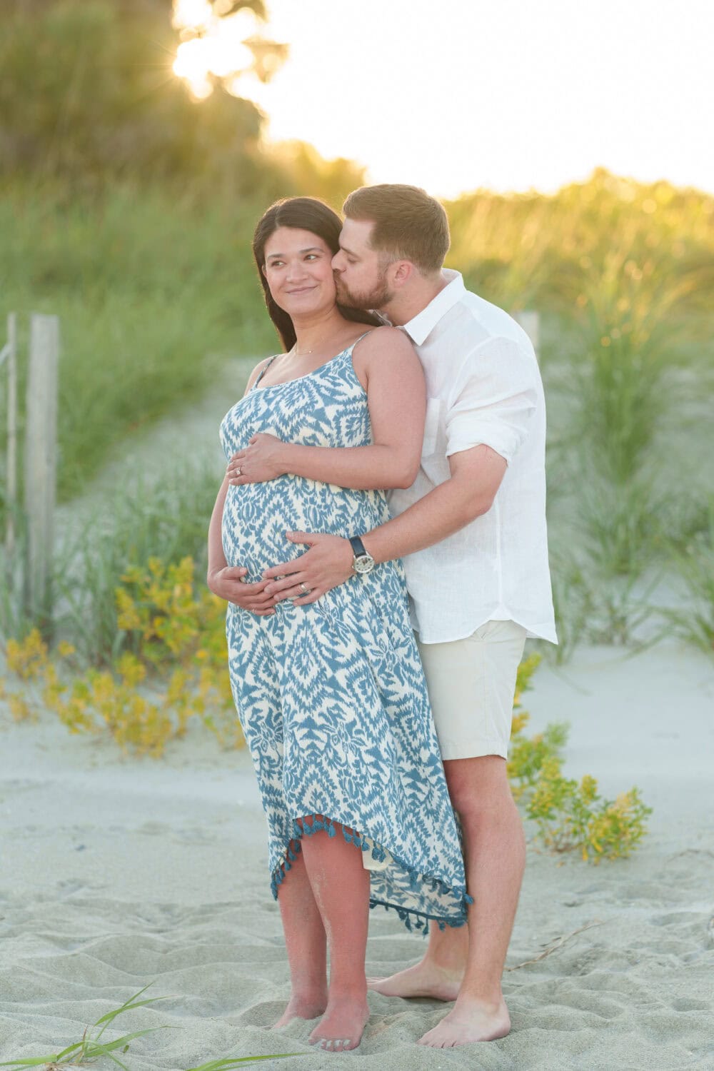 Maternity photos with their dog on the beach - Pawleys Island Beach House